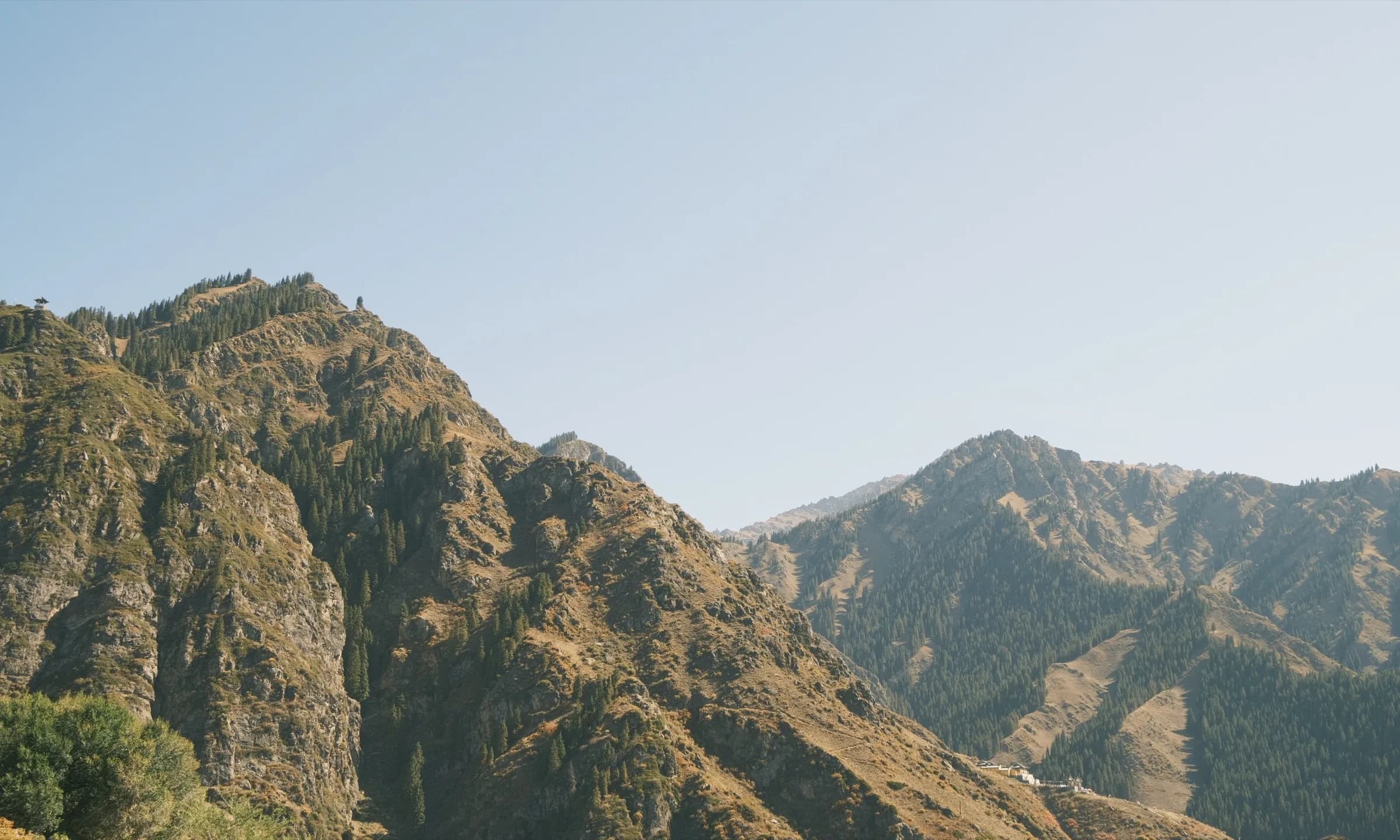 Jagged rocky peaks rising above a barren mountain range